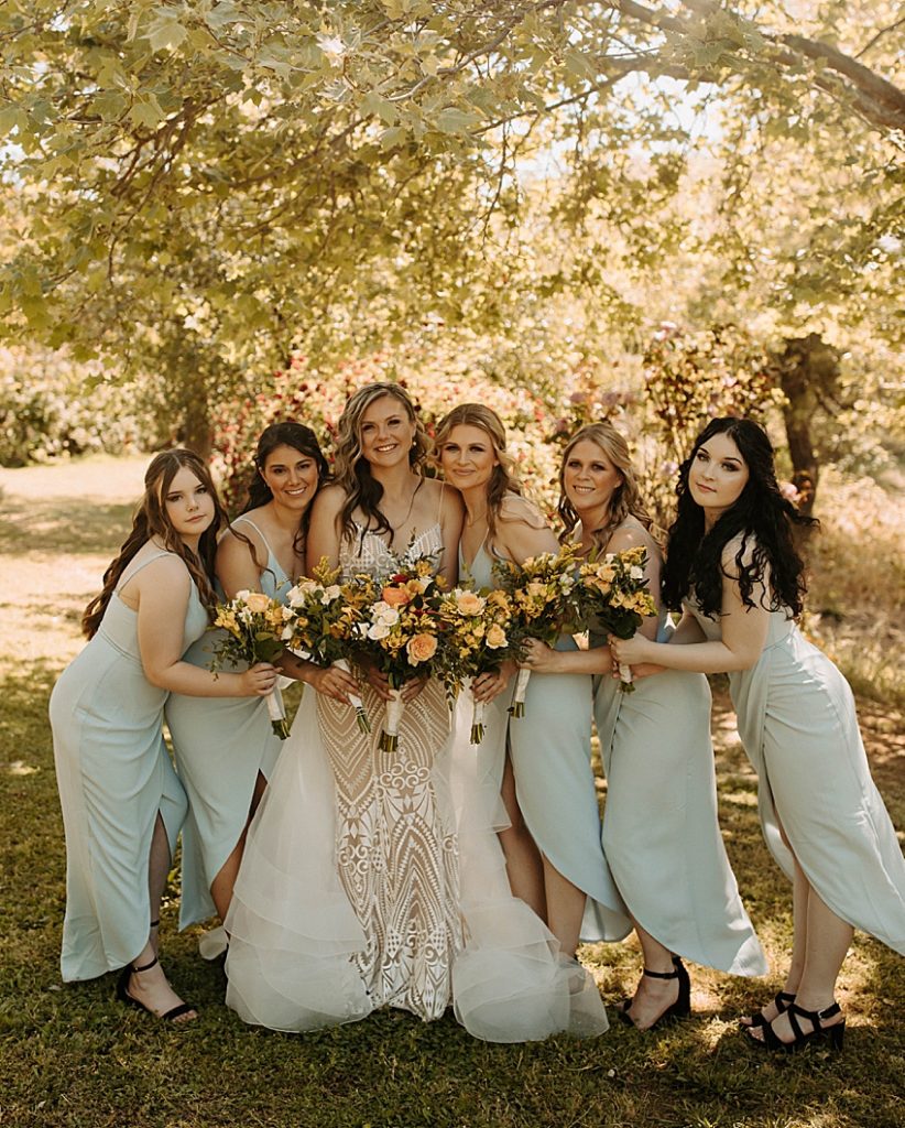 bride and bridesmaids in mint blue dresses