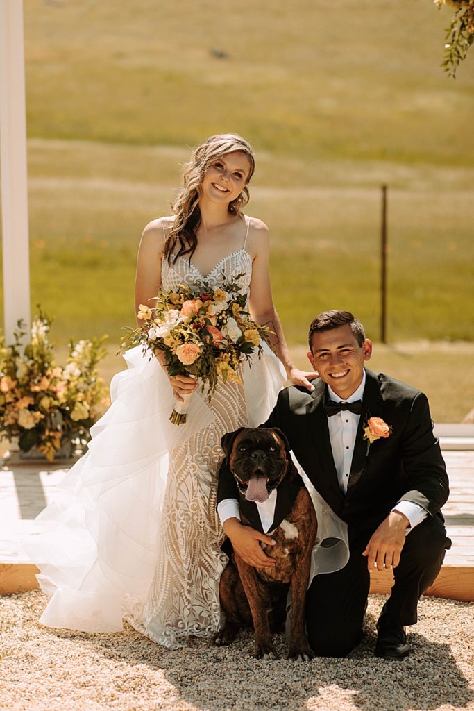 outdoor boho chic minimalist wedding ceremony with dog